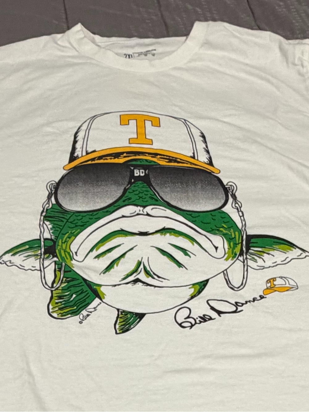 Bass Pro Shops White Tee with Green Fish Graphic and Yellow Hat Accent